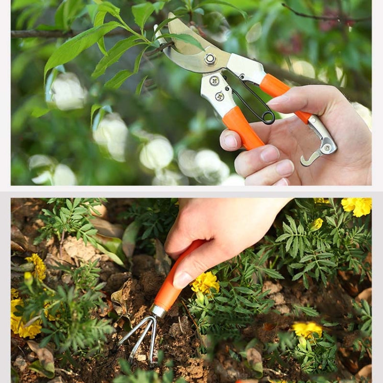 Orange-and-silver hand pruners and soil-tilling garden tool held for use