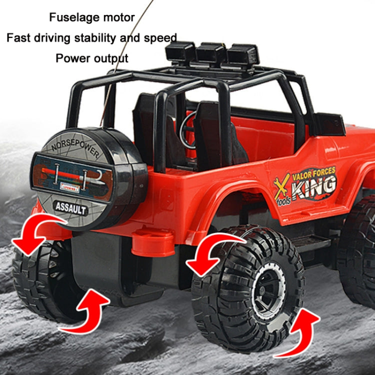 Close-up of red remote control off-road toy jeep with front winch and large tread tires