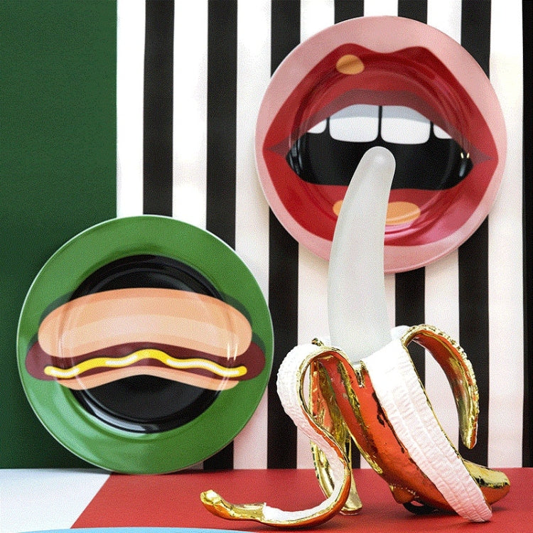 Banana-shaped table lamp with gold-brown finish and white peel, black power cord