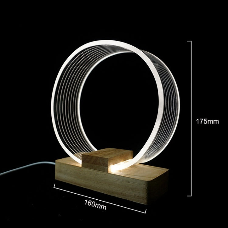 Acrylic ring table lamp with wooden base; 160mm x 175mm size marks
