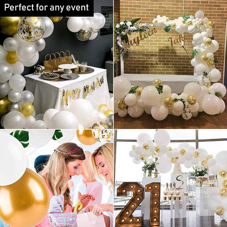 Event balloon garland with white, gold, and confetti balloons plus green leaf accents