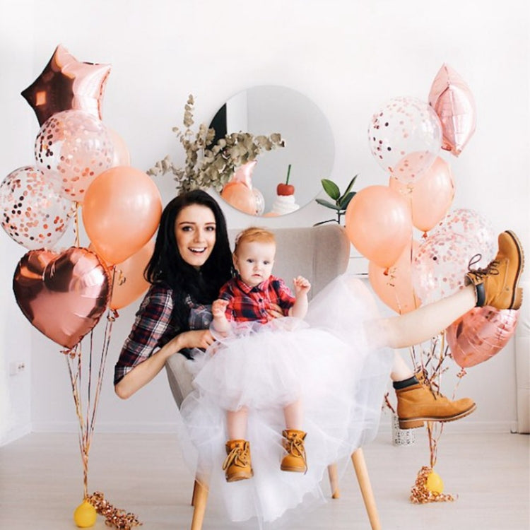Peach and pink confetti balloon bouquet with star-shaped foil balloons