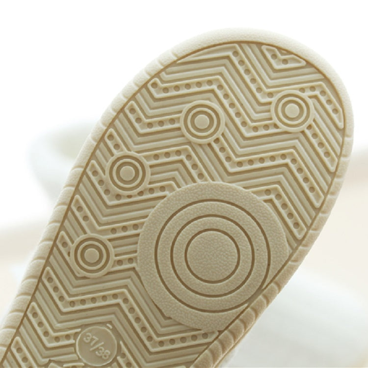 White slipper outsole with circular grip tread pattern and thick sole