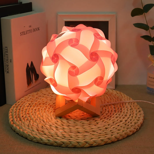 Pink USB bedside night light with wood base, round paper-flower shade, glowing