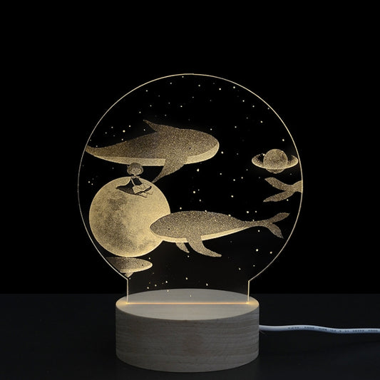 3D LED acrylic night light with whale silhouettes and stars on circular panel