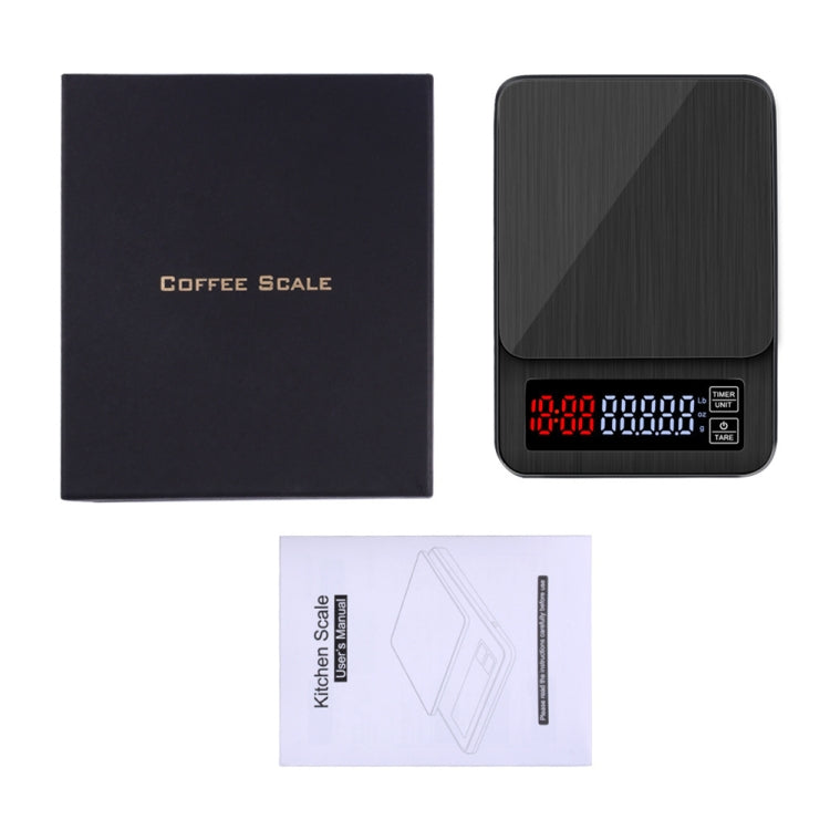 Black coffee scale with digital display and included instruction sheet
