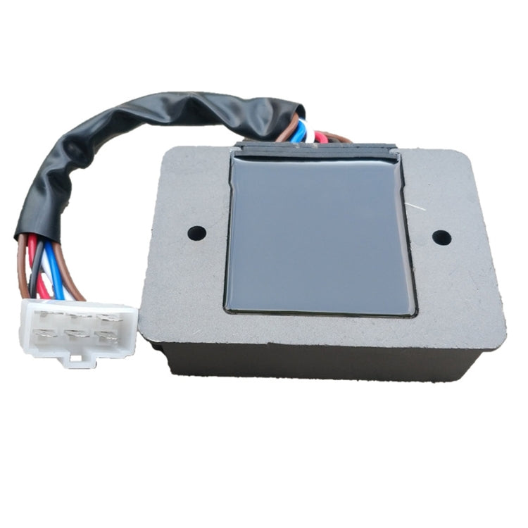 Grey voltage regulator rectifier module with black control window and white plug connector