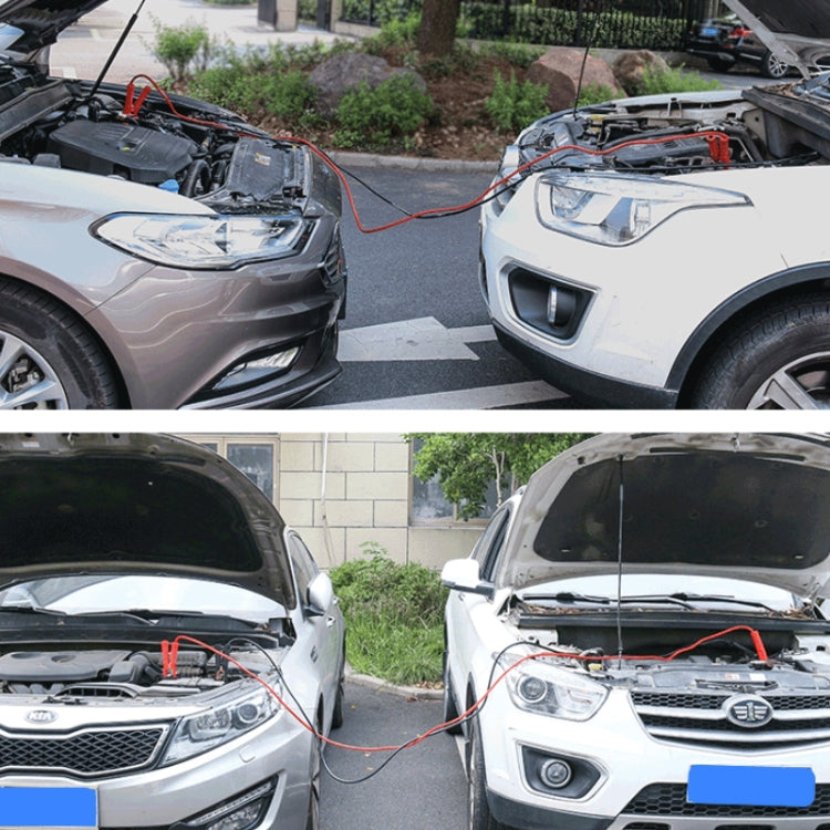 Two cars with hood open and battery jumper cables connecting engines
