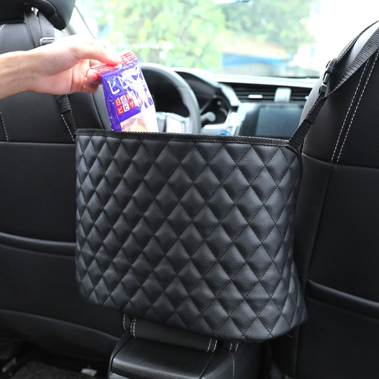 Black quilted car seat pocket holding snacks next to the driver seat