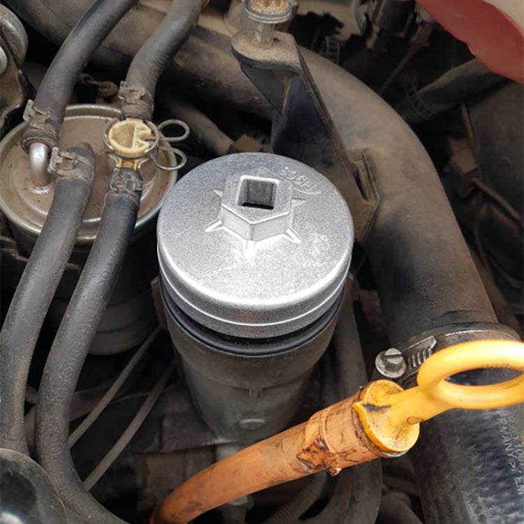 Aluminum oil filter wrench socket remover tool installed on engine oil filter housing
