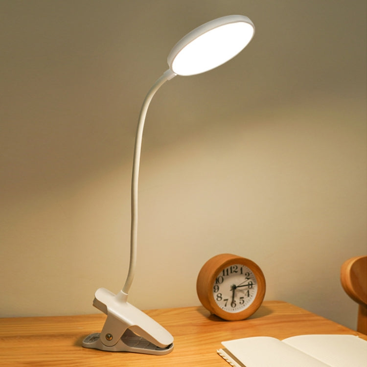 White LED clip desk lamp with round head and base clip on wooden desk