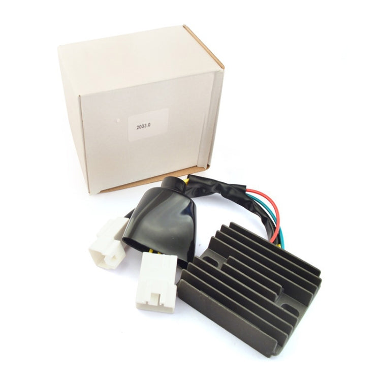 Motorcycle rectifier/regulator with black heatsink and white connectors, shown with box