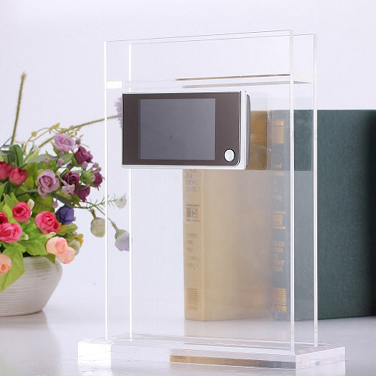 Video door viewer displayed inside a clear acrylic stand with mounted screen unit