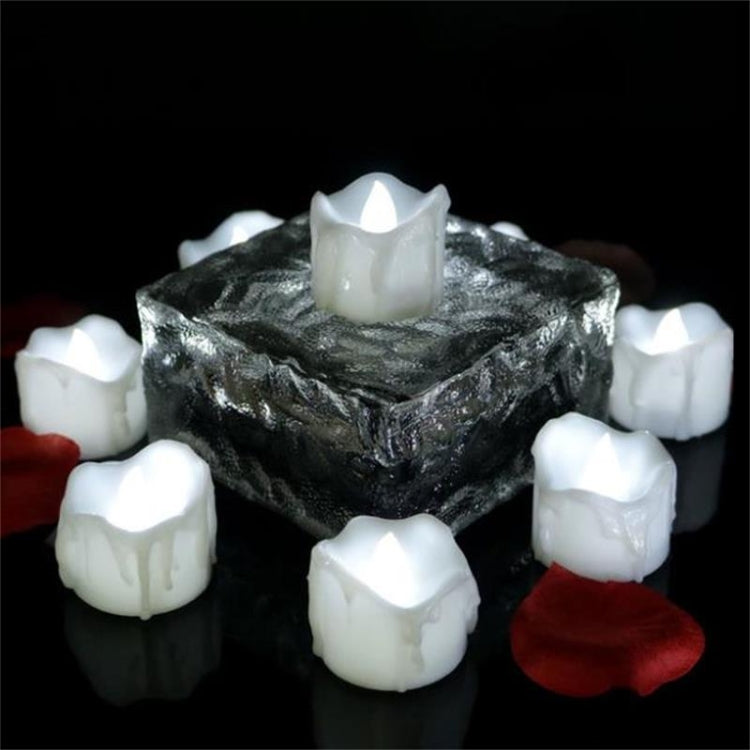 LED tea light candles set of 12 with warm white glow around a dark centerpiece