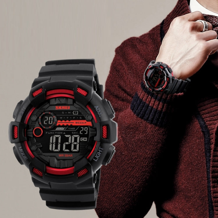 SKMEI men digital sports watch on wrist, black and red with digital display