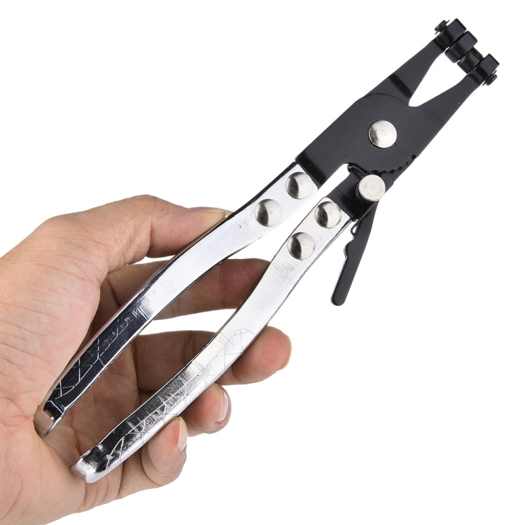Water pipe hose pliers in hand, black frame with silver jaws and thumb lever