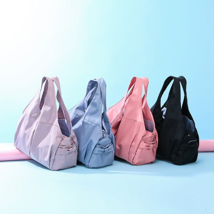 Set of sport gym duffel bags in light pink, light blue, deep pink, and black