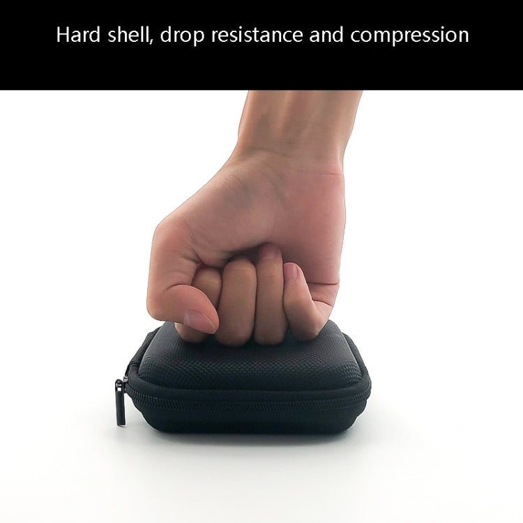 Black zippered storage case held in a hand, hard-shell drop and compression protection