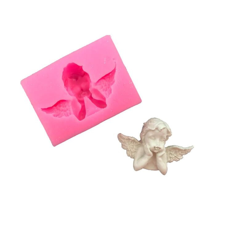 Pink angel-shaped silicone mold tray with cherub and wings relief
