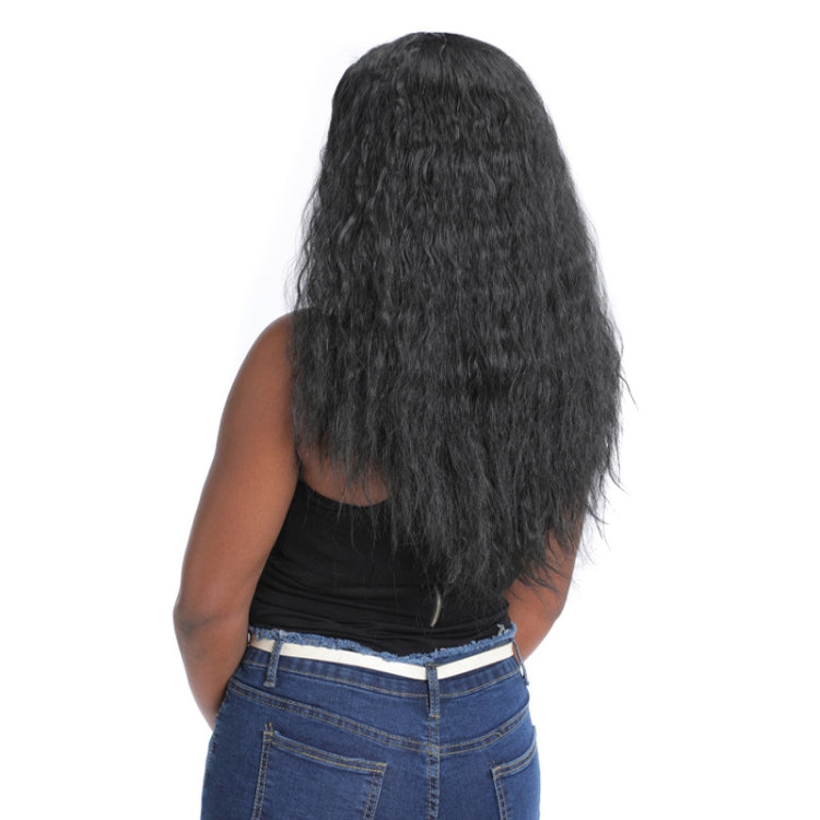Long curly black wig worn by model, back view over dark top