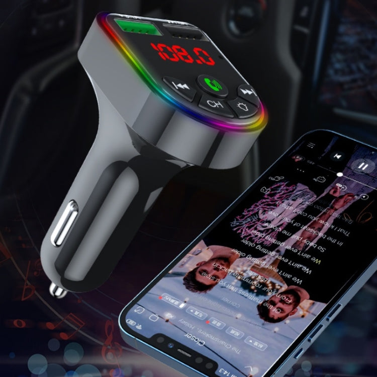 Car FM Bluetooth transmitter with red frequency display and rainbow-lit buttons on the dash