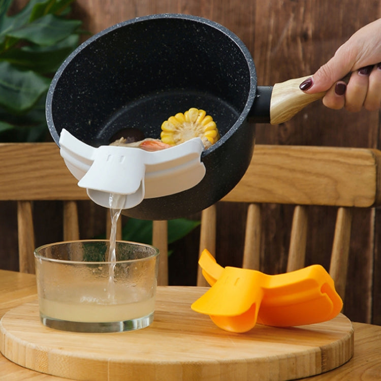Gray pour spout edge deflector for skillet, redirects liquid into glass