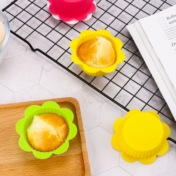 Flower-shaped silicone baking cups in yellow and lime green