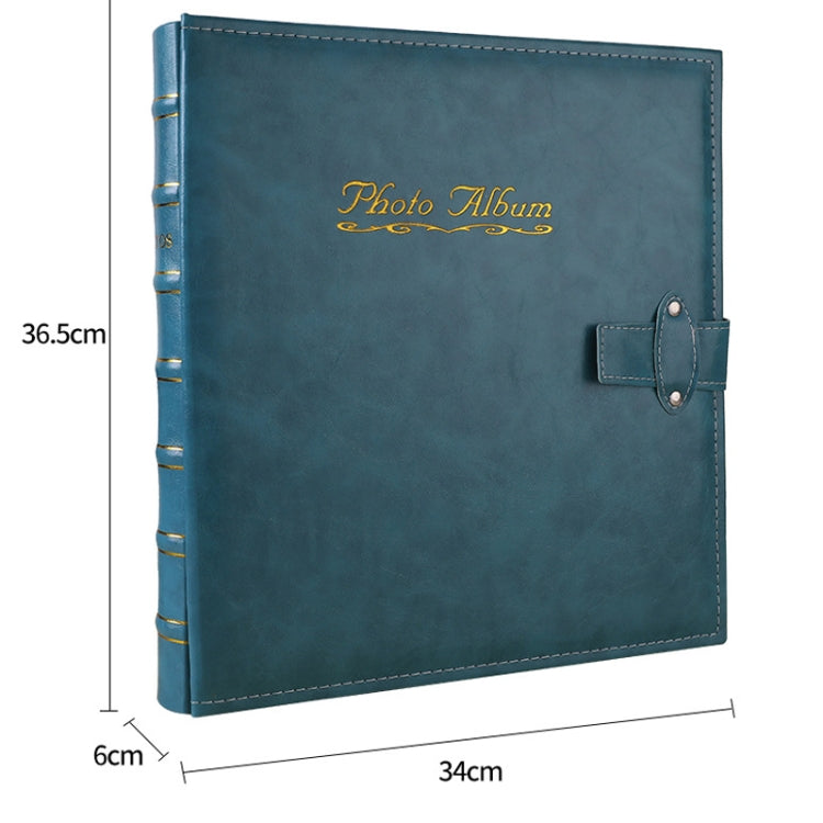 Blue photo album with front clasp, 'Photo Album' logo, stitched edges; 34cm x 36.5cm