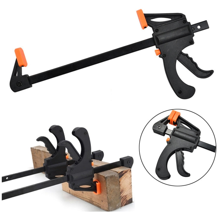 Bar wood clip clamp tool with black arm, orange releases, and grip for boards