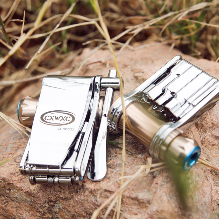 Bicycle CO2 inflator multitool on rocks with chrome handle and blue knob