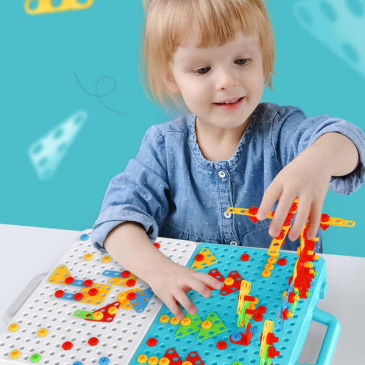 Child using a blue children screw-tightening drill assembly toy on the workbench
