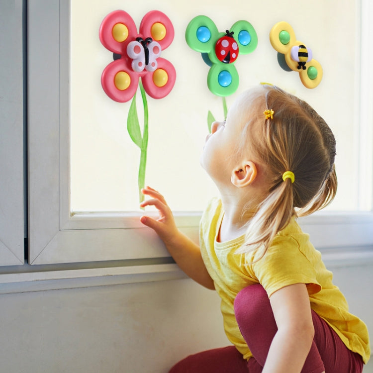 Colorful insect suction spinner rattle toys: pink, green, and yellow wall-mounted pieces