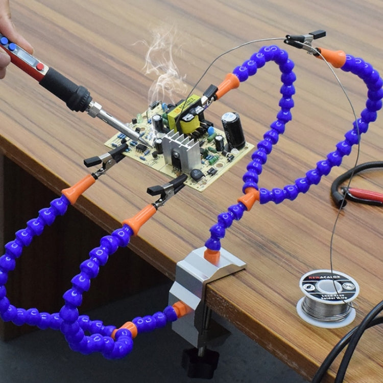 Arm welding station mounted on a workbench with blue bead clamps and metal head