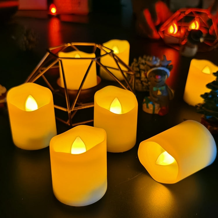 Set of three LED pillar candles with warm glowing flames, battery powered