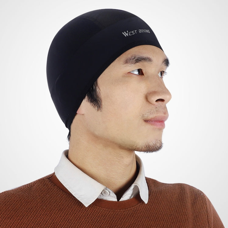 Black helmet liner cap on man, snug fit with front logo
