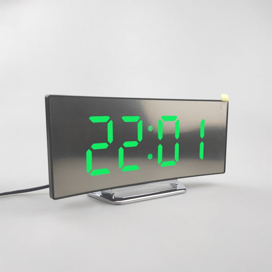 Curved LED mirror alarm clock showing green time 22:01