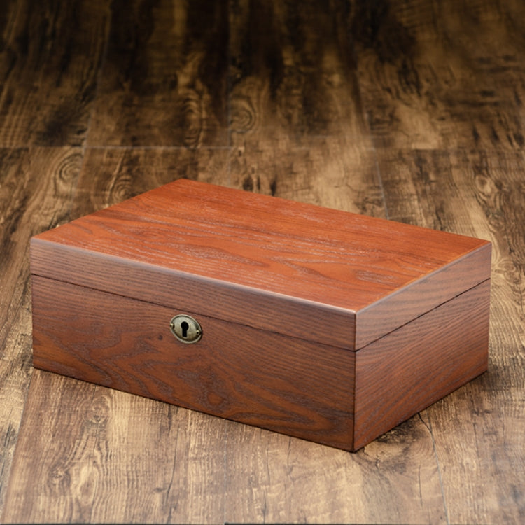 Closed wooden watch storage box with round keyhole knob on top