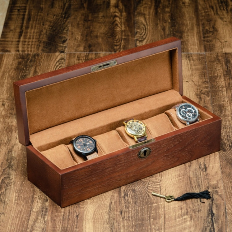6-slot wooden watch storage box open with tan cushions and multiple watches in compartments