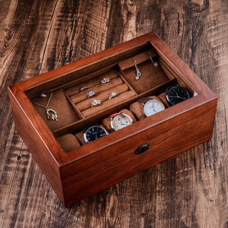 Brown wooden watch storage box with lock, open top compartments holding watches and jewelry