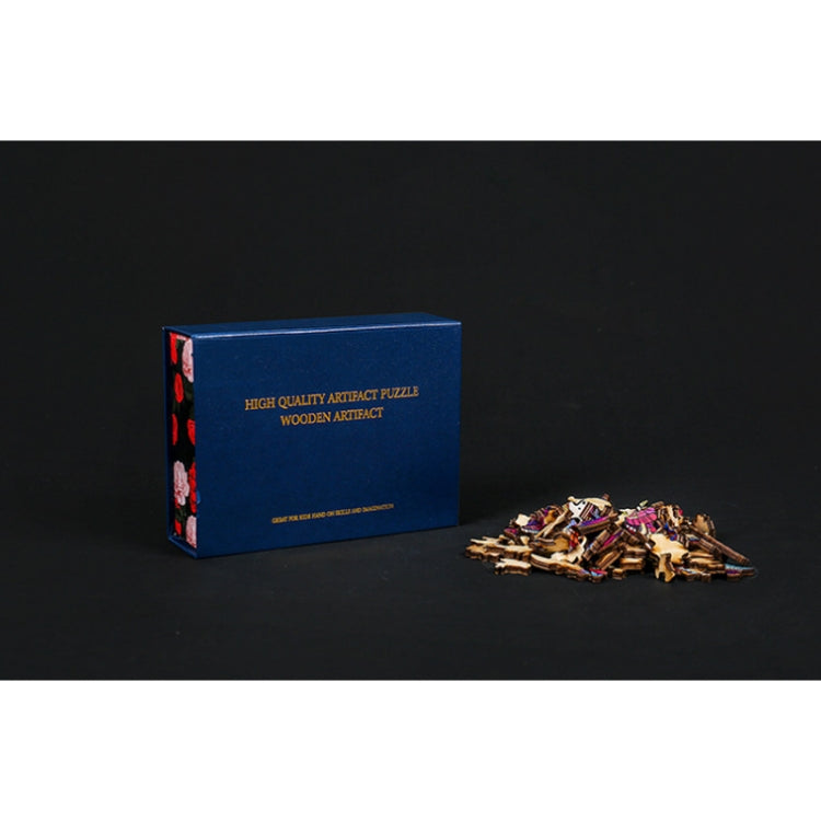 Wooden puzzle box and scattered butterfly-shaped wooden pieces