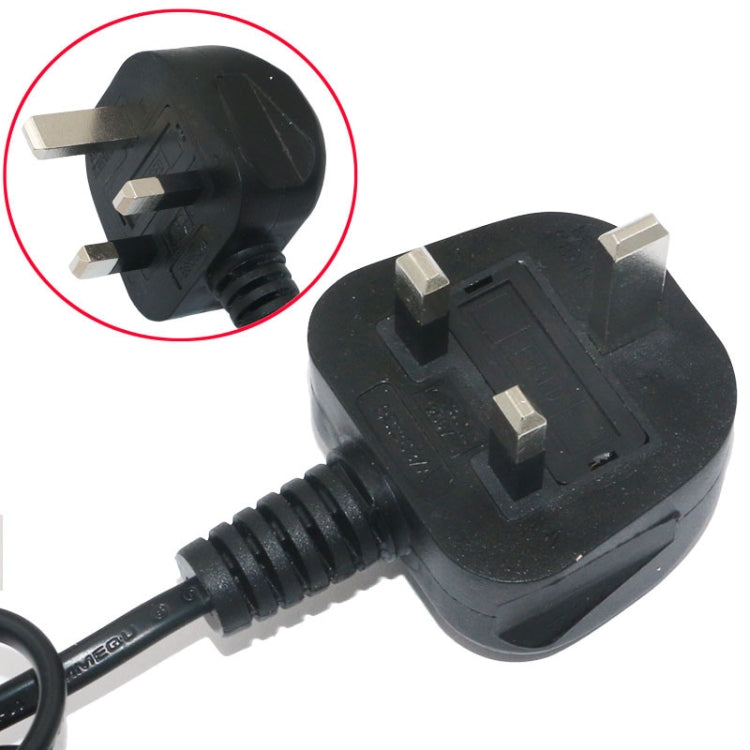 Black UK plug connector with prongs attached to hot air gun power cable