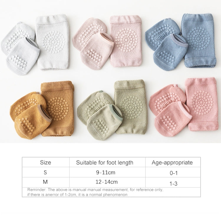 Assorted colors of baby knee pad floor socks with circular textured non-slip grip pads