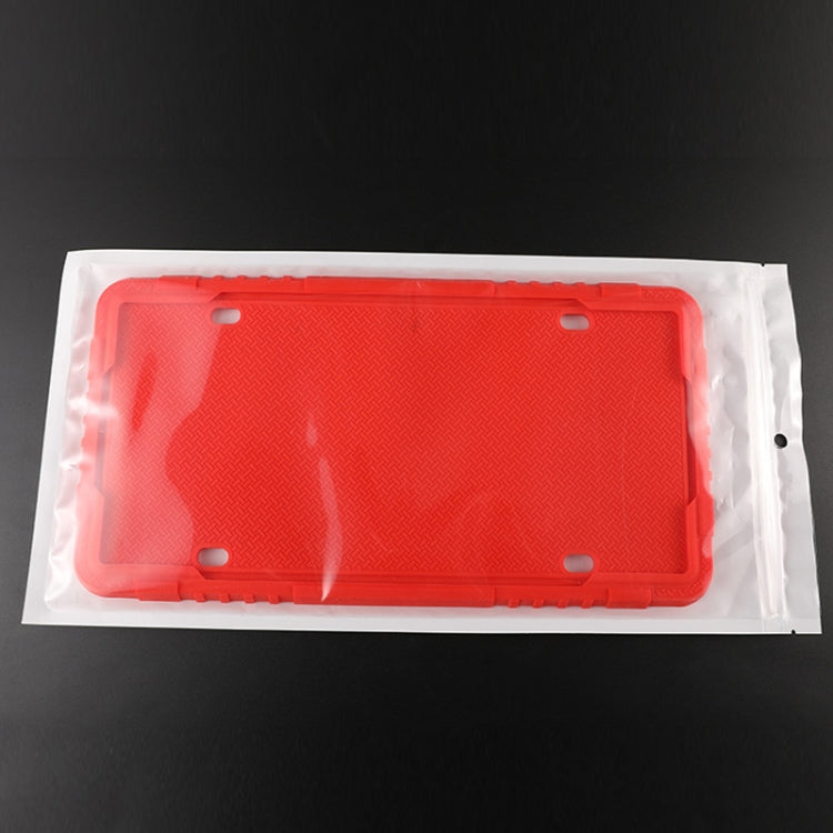 Red silicone license plate frame in clear protective packaging