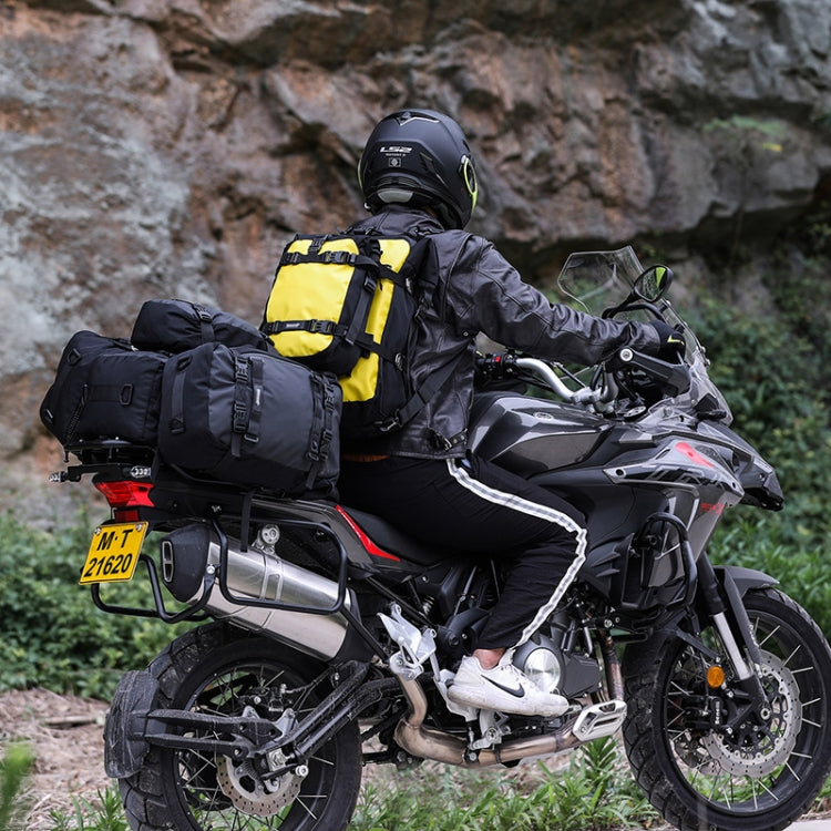 Motorcycle rear seat bag with black and yellow panniers mounted on a bike