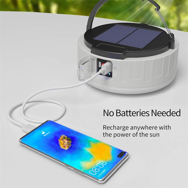 Solar emergency light charging a phone via USB port with white power cable