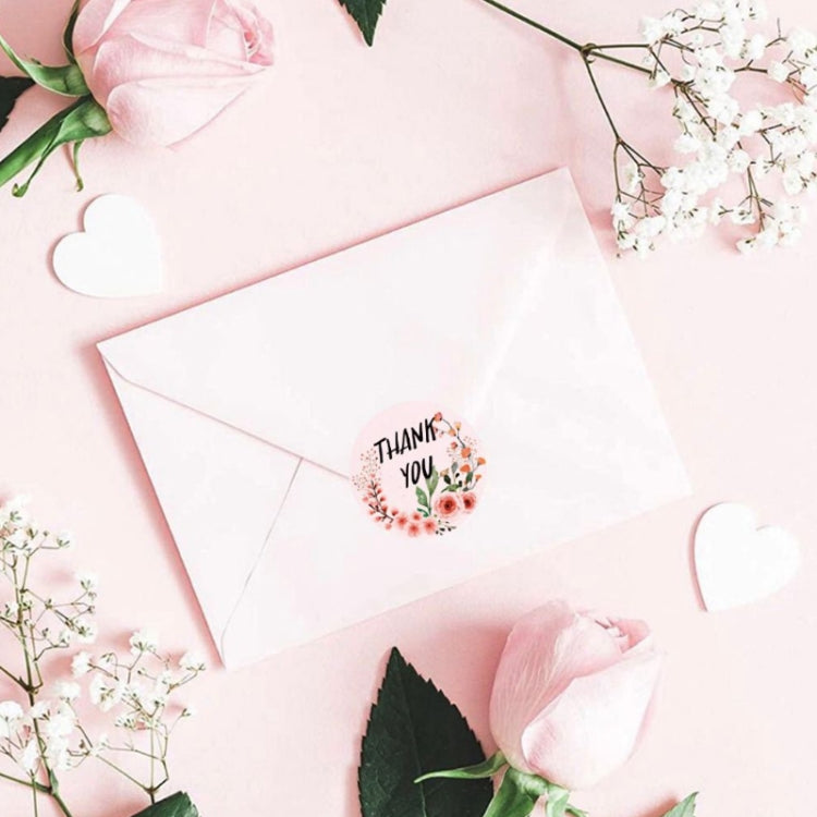 Round thank you sticker seals on envelopes, with small floral wreath print