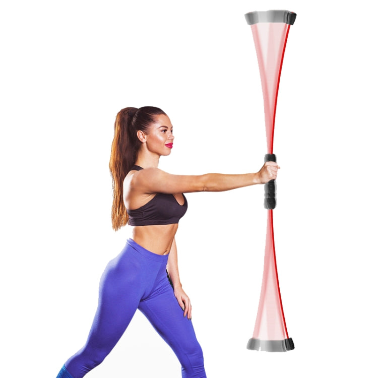 Red training tremor stick with black handle grip and gray base, held during exercise