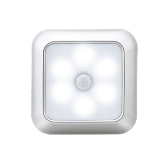Square motion-sensor night light with cool white glow and round infrared sensor, silver-white body