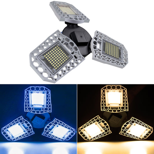 Folding tri-leaf LED garage light with three gray panel heads and black base