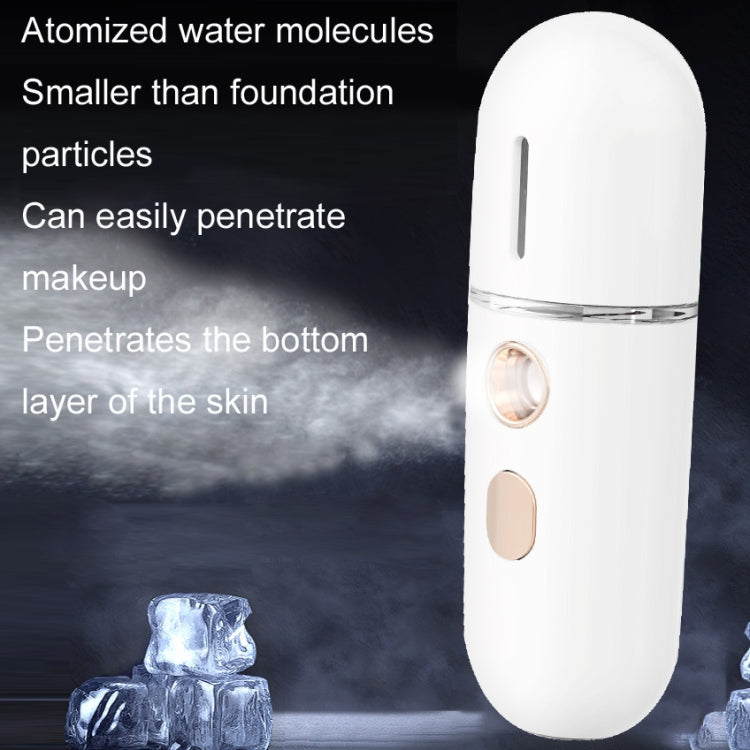 White humidifying sprayer with mist plume rising from clear top; two front control buttons